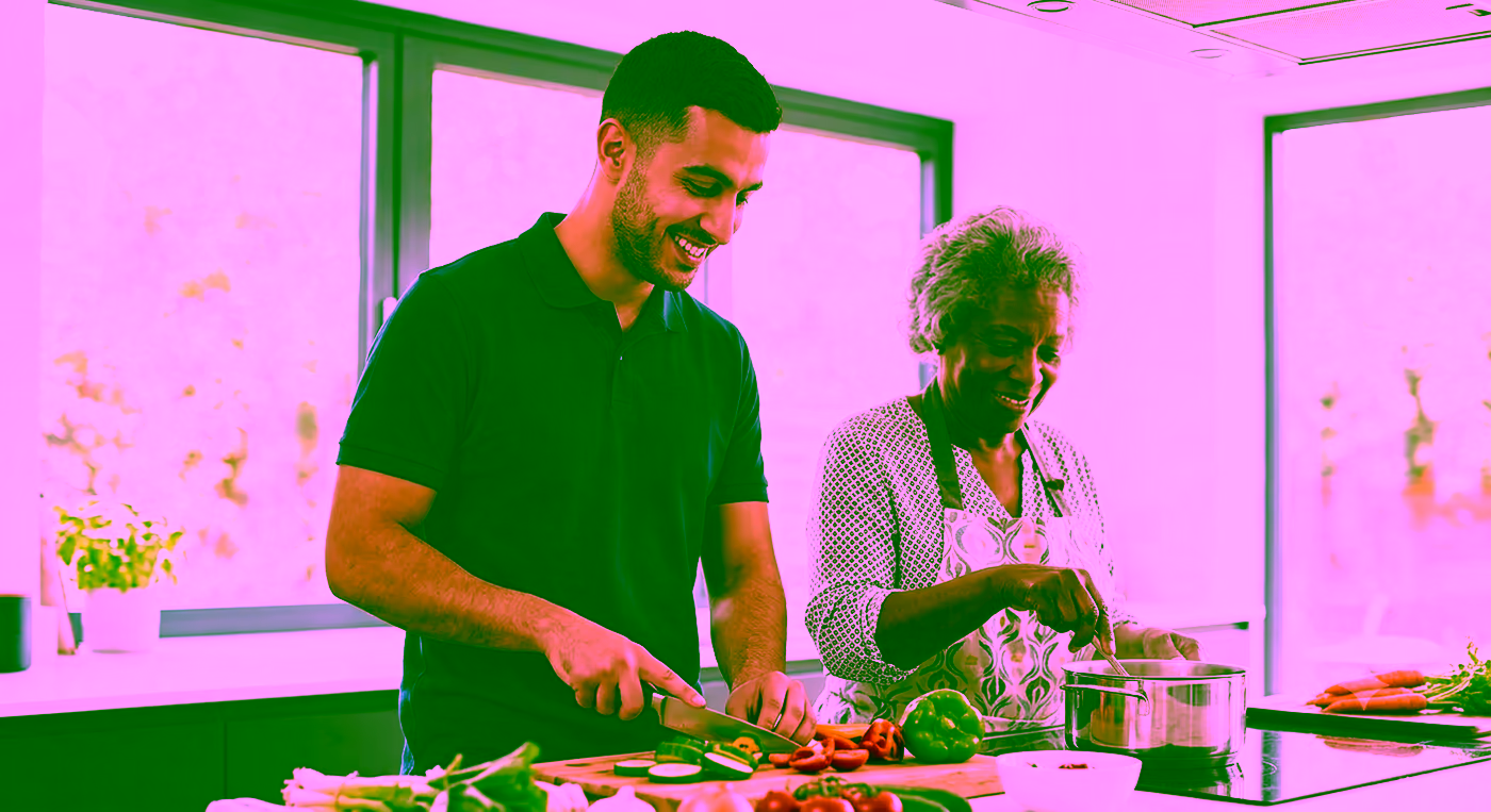 A Dendera Care carer preparing a fresh meal together with an older woman